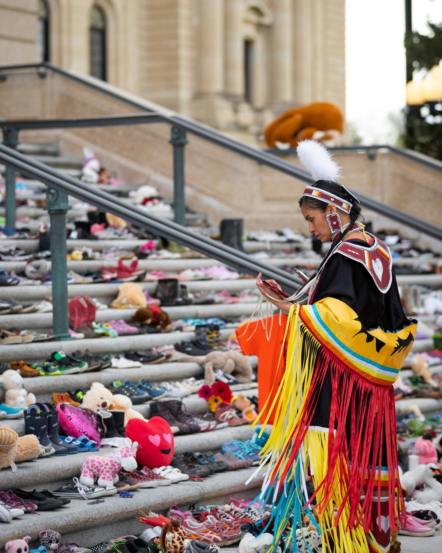 On the National Day for Truth and Reconciliation Day, September 30, Canadian Jesuits International (CJI) expresses its solidarity with Indigenous peoples in Canada and honours residential school survivors, their families, and the children who were never able to return home. 
CJI recognizes the devastating and inter-generational  impacts of Canada’s residential school system and reaffirms its commitment to truth and reconciliation. It also joins calls for the full implementation of the UN Declaration on the Rights of Indigenous Peoples in Canada. 
As an international social justice organization, CJI supports projects in the Global South that support Indigenous peoples protect their lands, preserve their languages and cultures, and affirms their human rights, including self-determination. CJI also supports Indigenous-led peacebuilding efforts, and Indigenous women's leadership in Latin America, among others. 
Its Jesuit partners include the AC Indigenous Rights Centre (CEDIAC) in Chiapas, Mexico, which promotes conflict resolution through Indigenous reconciliation systems. 
 
CJI recognizes that Indigenous peoples hold traditional ecological knowledge critical to environmental protection. The Jesuit-based Solidarity Network of the Indigenous Apostolate helps protect our common home and supports Indigenous women leaders defending ancestral territories and cultures throughout Latin America. 

Photo by Tandem X Visuals on Unsplash/ Stuffed toys and shoes are laid out on the steps of Saskatchewan's Legislative Building in Regina to remember residential schools children who never made it back home.